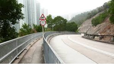 Traffic sign post and railing in Hong Kong